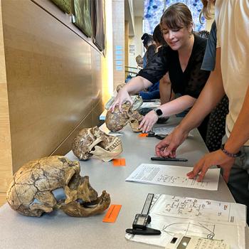 Kimberly Paczolt helping students during a class activity