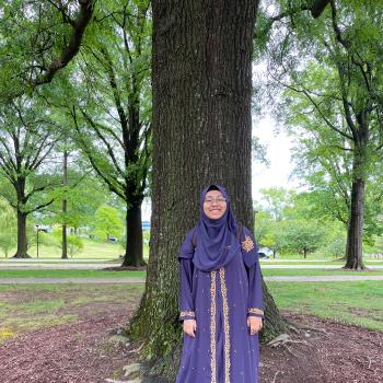 Muntaha Hossain standing in front of a tree