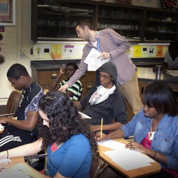 Teacher in classroom with students